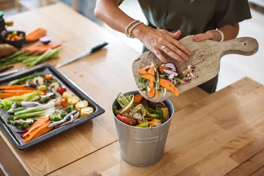 Vegetable preparation scraps being collected separately in a container